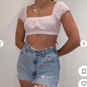 Brandy Melville light pink crop top with elastic bands and ruffle edges